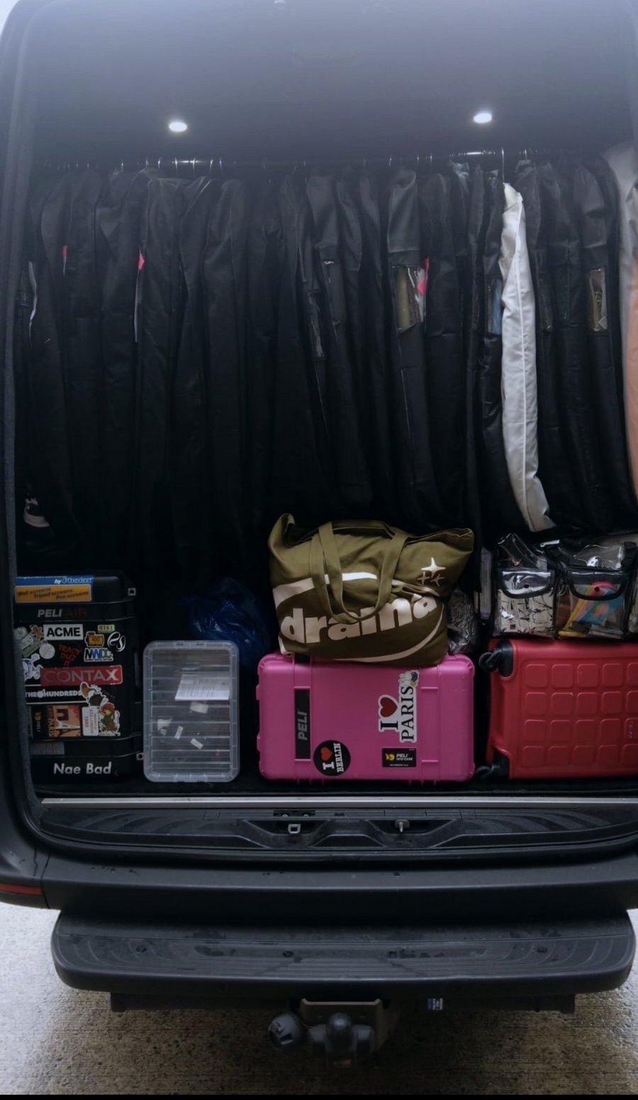 Garment rail and flight cases loaded into the rear of an R5 Executive Travel Mercedes Sprinter for a production move