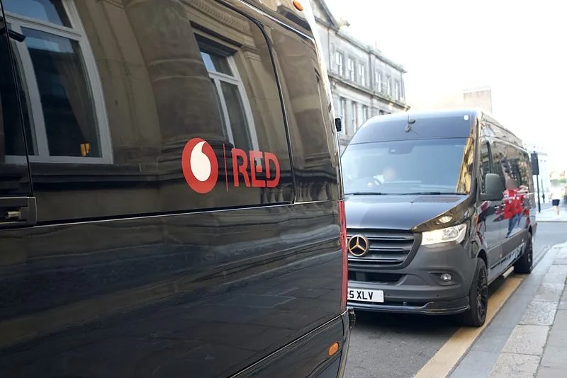 An R5 Mercedes Sprinter in a client's livery, with a second Sprinter behind